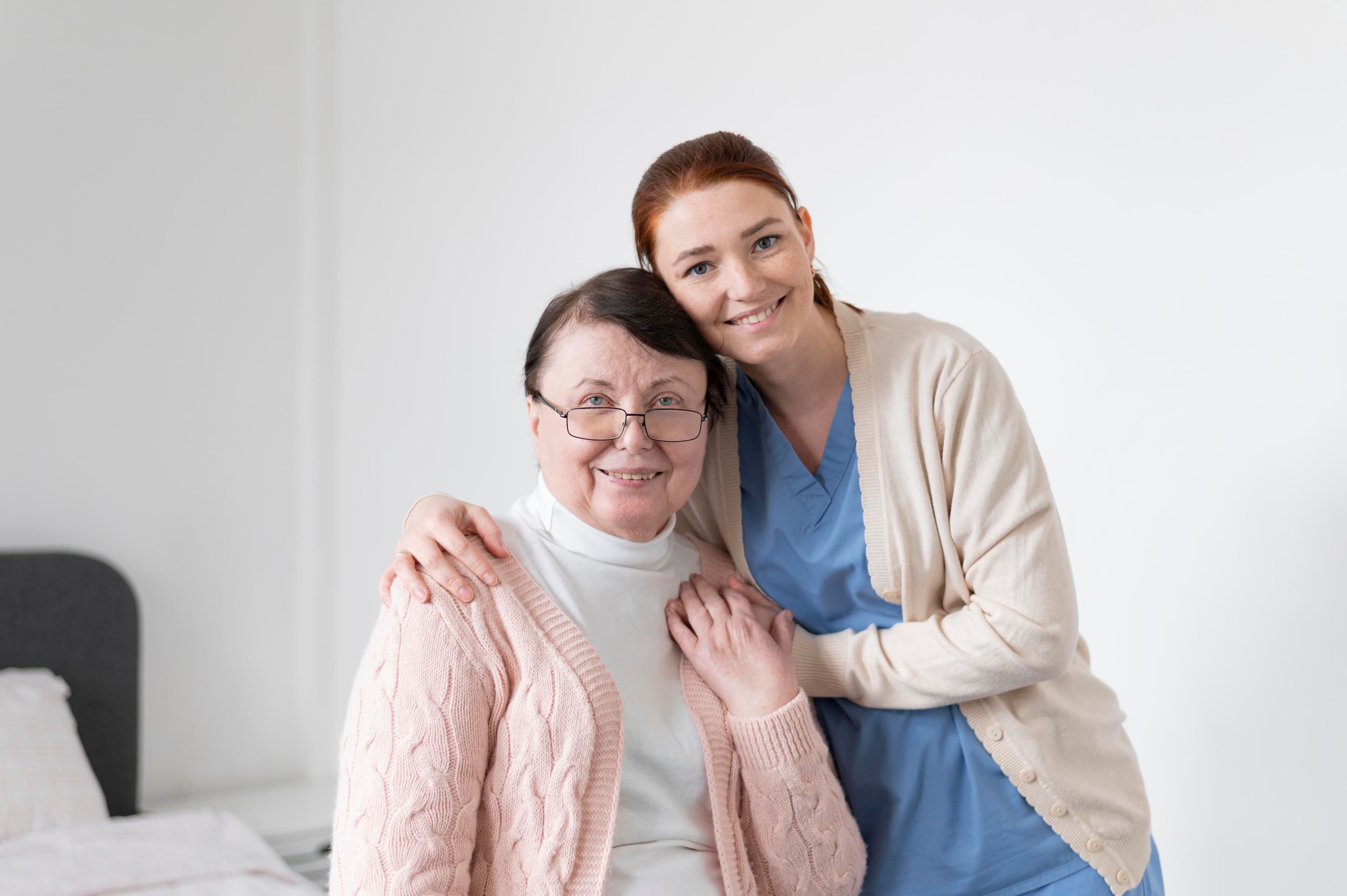 A compassionate caregiver assisting an elderly patient at home